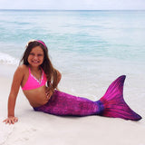 mermaid tail on the beach swimming pink and purple