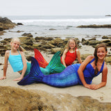 Mermaids on the beach in Sun Tail Mermaid tails and monofins