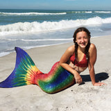 Mermaid tail rainbow on beach